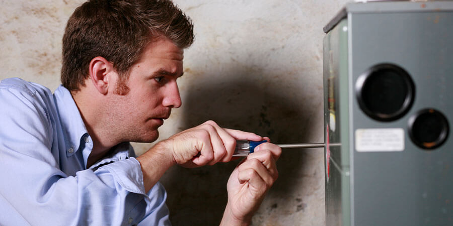 Service technician readjusting heater shell