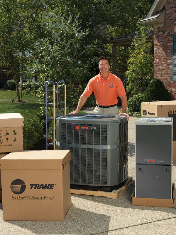 Trane dealer with new HVAC system outside home