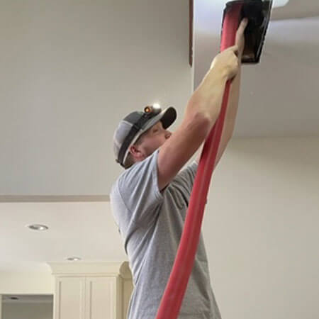 Springfield service technician cleaning air duct